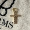 Kors charm